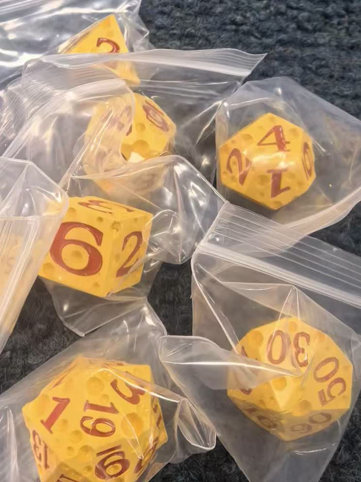Bulk D4 to D20 polyhedral dice sorted for carton packing