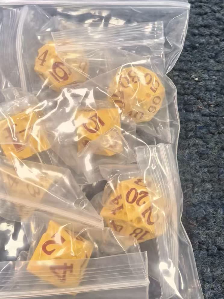 Plated polyhedral metal RPG dice set in a rich multi-tone finish
