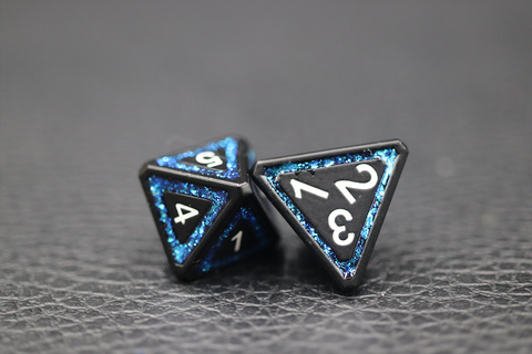 Two four-sided dice in blue and black, points up